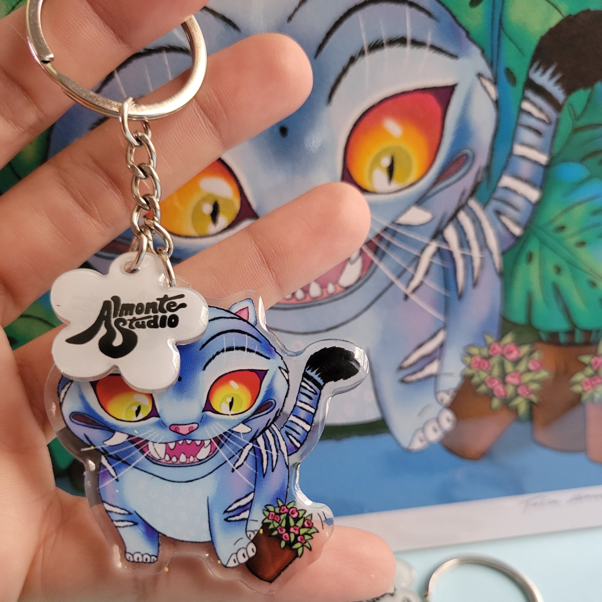 Derpy Tiger from Kpop Demon Hunters keychain held by a hand with a colorful background